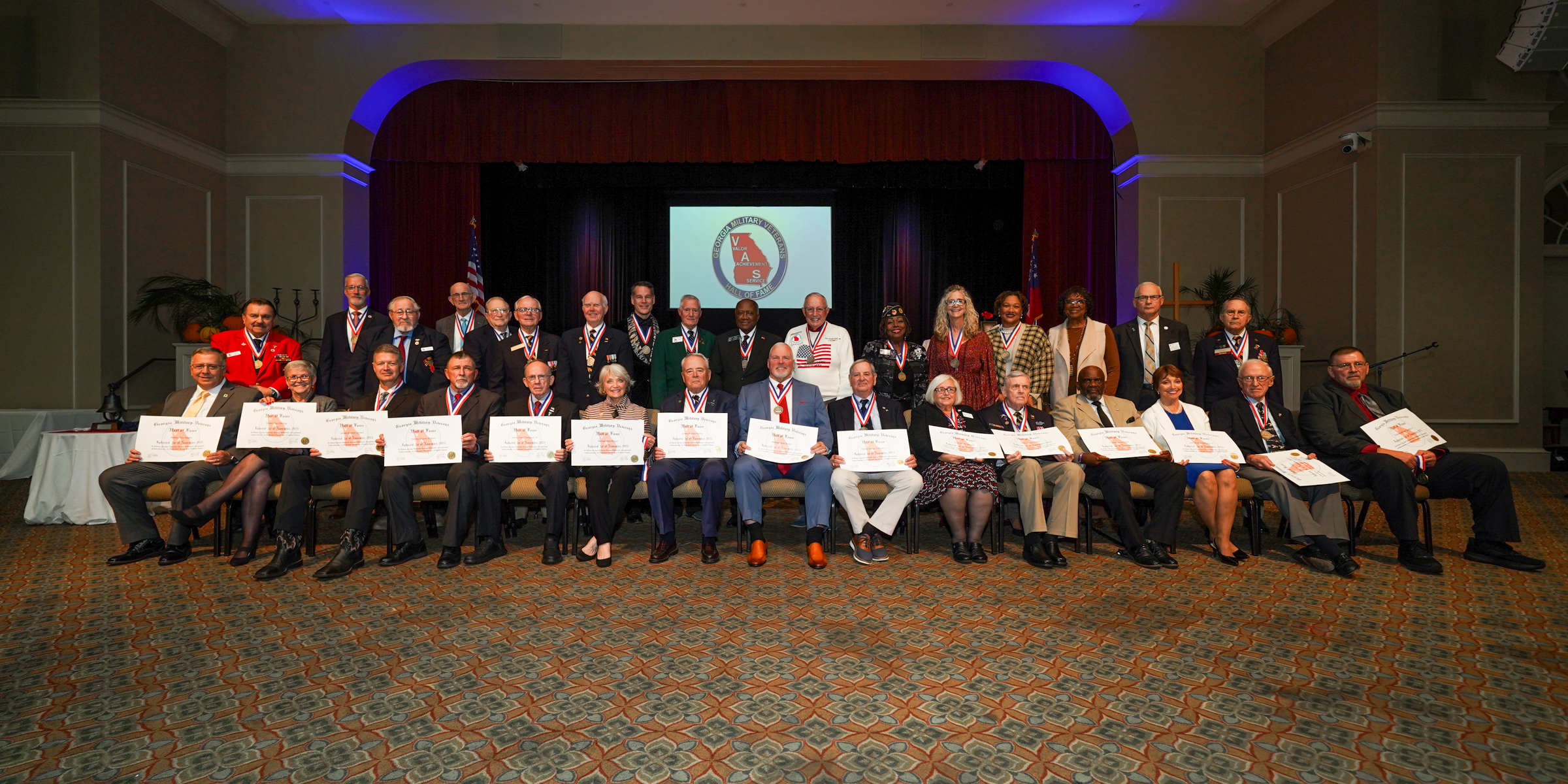 Full class group photo on stage